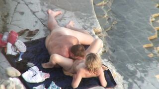 Munching her twat on the beach